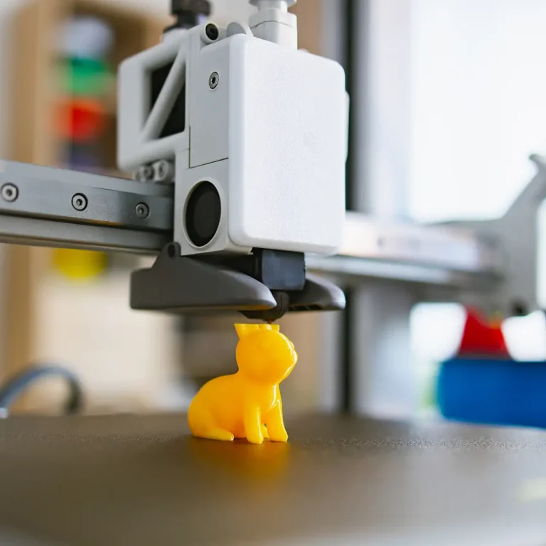 3d-printing-stk-3d-printing-a-yellow-cat-figurine-2026-04-01-16-54-50-utc