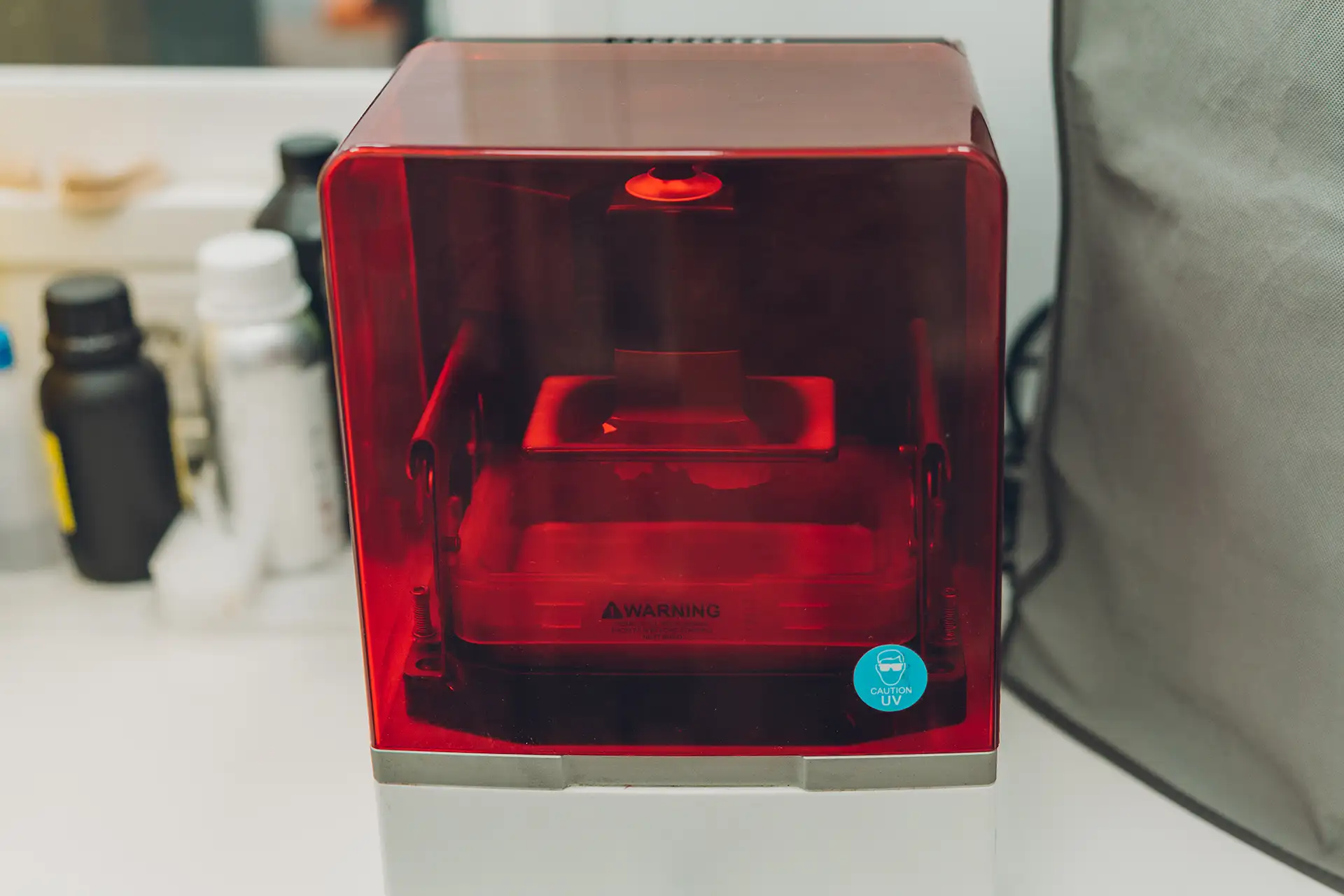 Resin 3D printer printing small prototypes Resin MSLA 3D printer printing small high-detail prototypes with UV curing