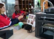 Engineers working at a 3D printing workshop with FDM printers