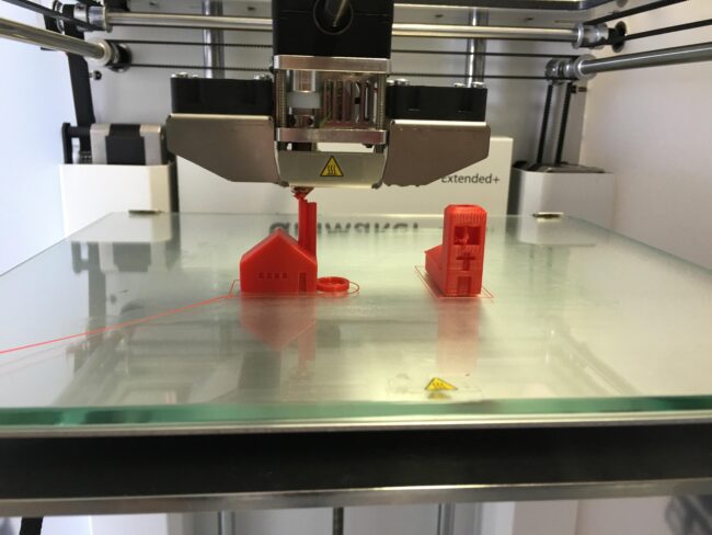 3D printer with glass print bed showing bed surface type for FDM printing