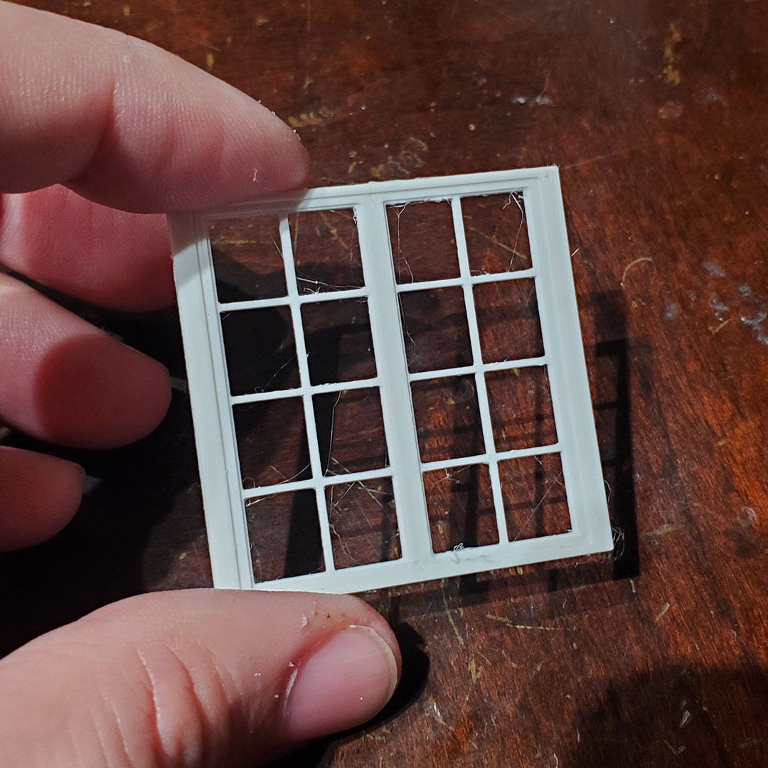 OreKo miniature window with planter box 3D printed in white PLA showing shutter detail close up