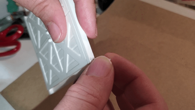 Animated GIF showing OreKo miniature window shutter opening and closing motion on completed 3D printed assembly