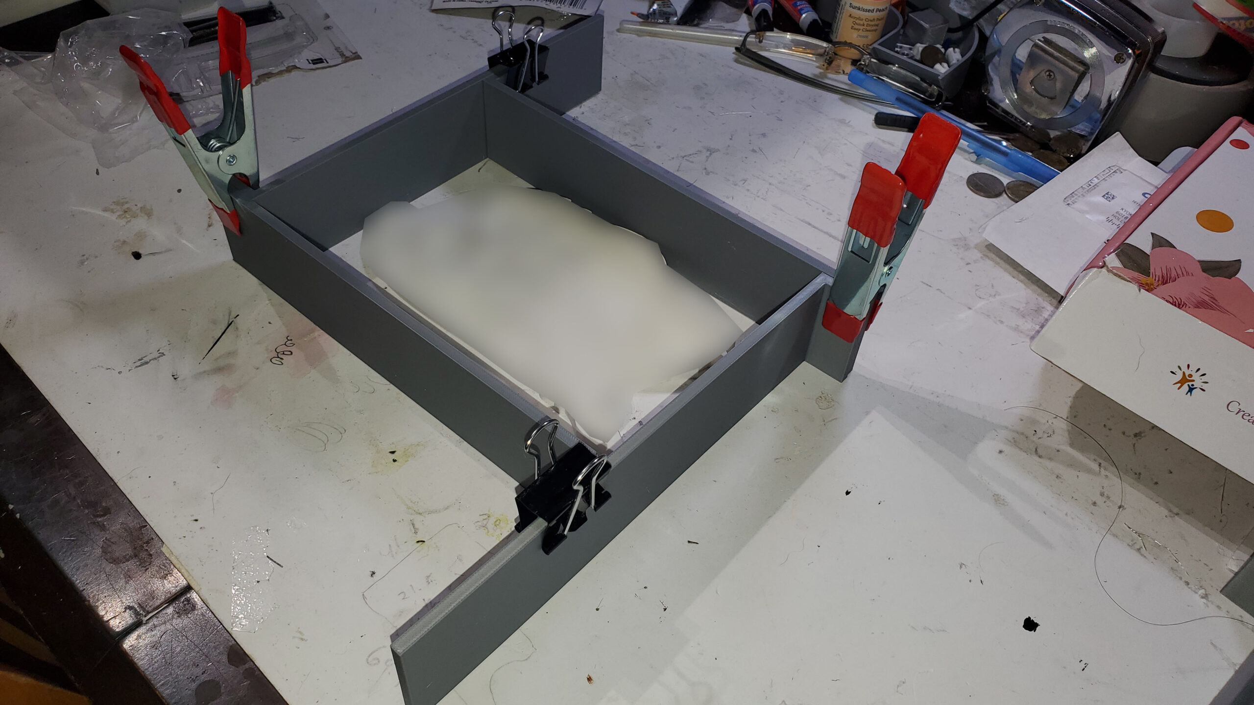 OreKo XL adjustable mold box in use as a silicone mold frame showing fully assembled casting enclosure