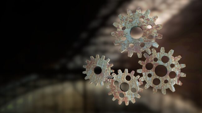 Steampunk gears representing mechanical 3D printing and living hinge movement