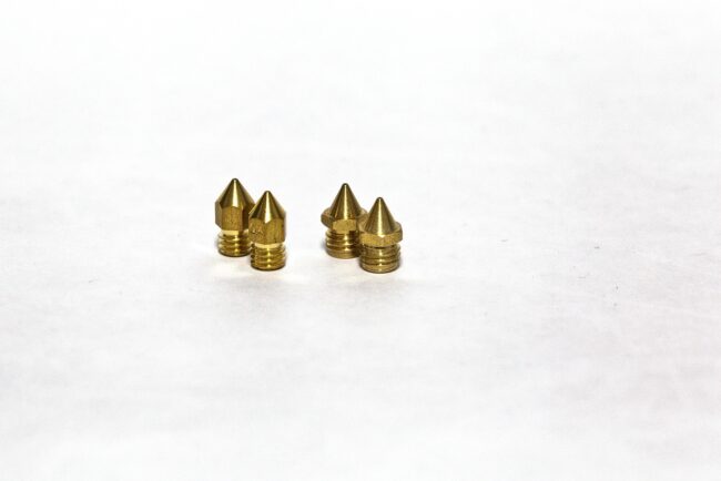 nozzles-1920 Various 3D printer nozzles showing different sizes and materials including brass and hardened steel