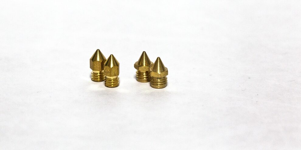 nozzles-1920 Various 3D printer nozzles showing different sizes and materials including brass and hardened steel